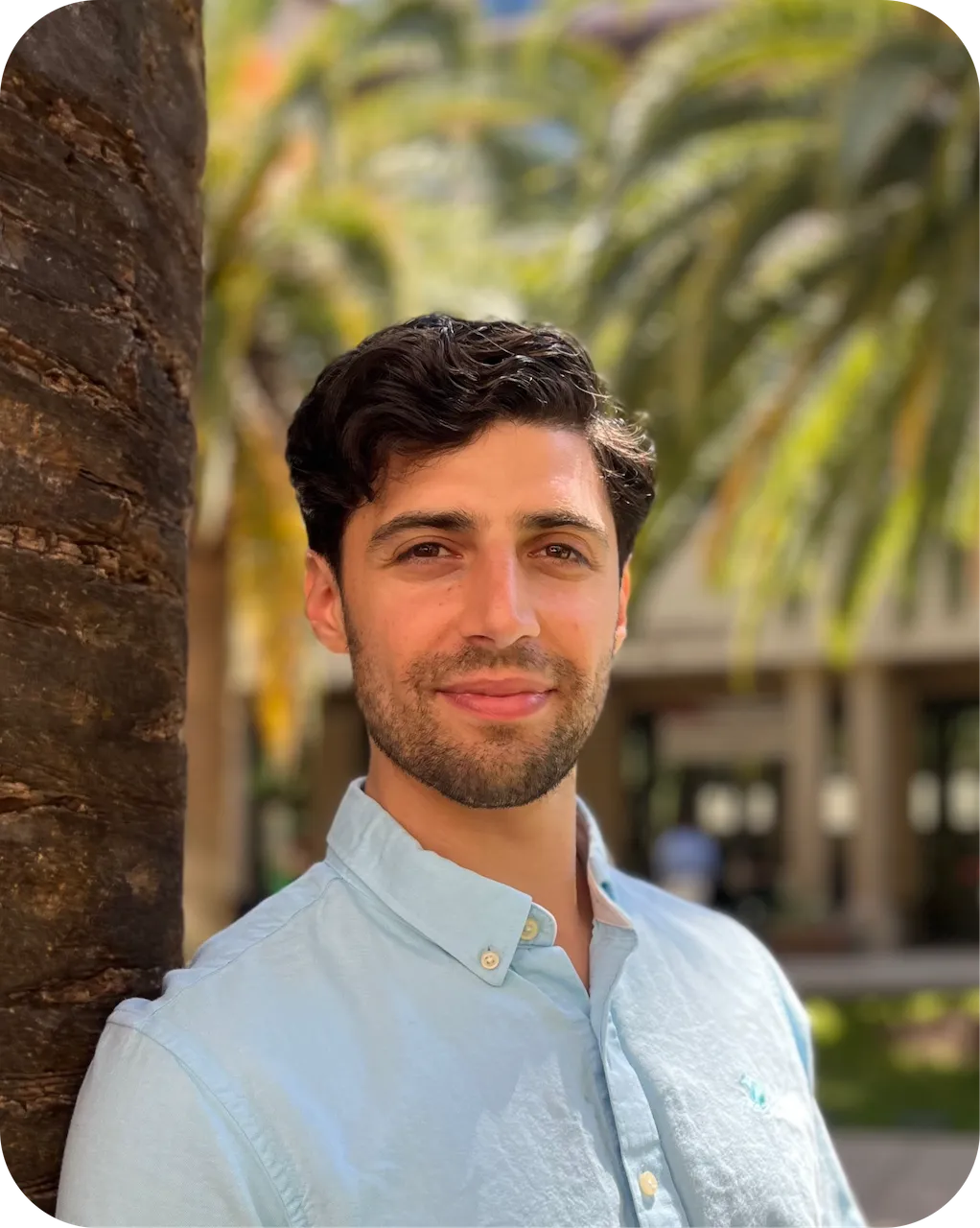 Portrait of Gianni Glick outdoors.
